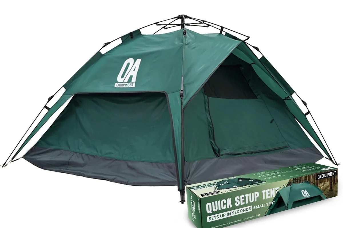 Sleeping bag laid out on campsite ground with backpacking gear nearby