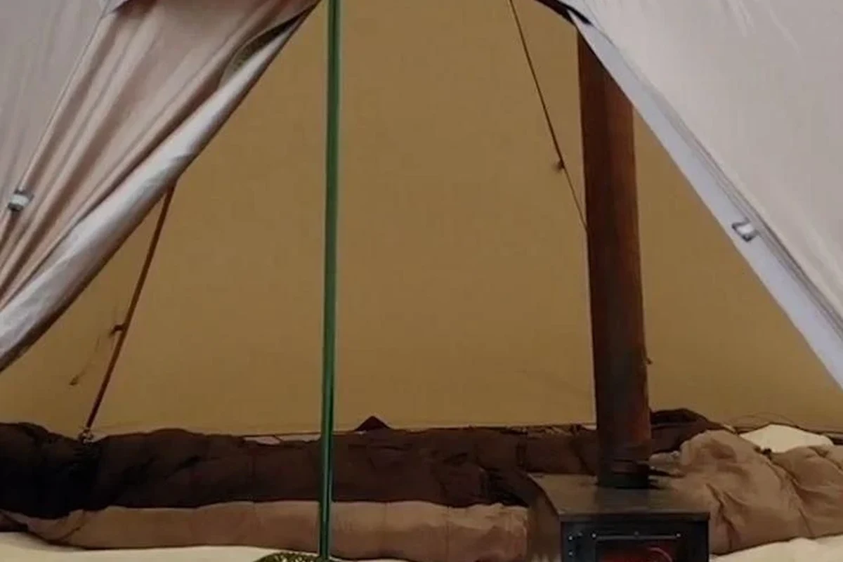 Down sleeping bag stored loosely in a breathable sack inside a dry closet